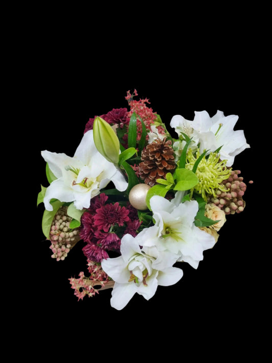 Bouquet of flowers wrapped in brown paper on a dark surface